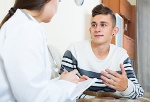 Young man learning about treatments for drug abuse
