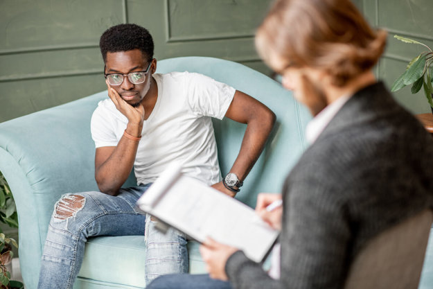 african american man looking at hipster man in a suit with wonderment trying to figure out what is clinical mental health counseling